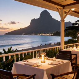 Caribbean Holidays, Montserrat Luxury Holidays, A beautifully presented Caribbean dinner on a peaceful Montserrat restaurant terrace, with ocean views and warm evening light