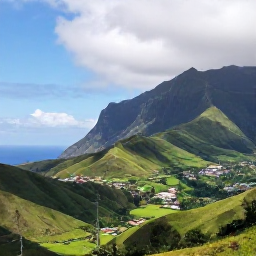 Caribbean Holidays, Montserrat Tours, A scenic view of Montserrat's green volcanic hills, coastline and villages under bright Caribbean skies