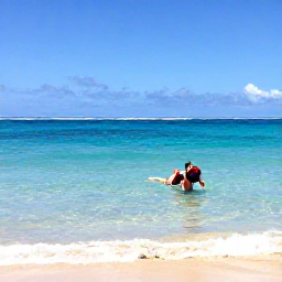 Caribbean Holidays, November Backpacking, Backpacker swimming and snorkelling in clear water beside a quiet Grenadine beach