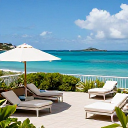 Caribbean Holidays, November Escapes, A relaxed adults-only hotel terrace overlooking a turquoise Caribbean sea in Saint Barth&eacute;lemy during November