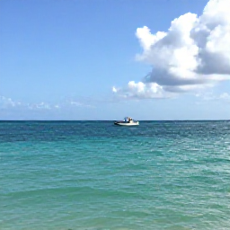 Caribbean Holidays, November Fishing, A calm turquoise sea off Providenciales in November, with a small fishing boat on the horizon and bright Caribbean sunshine