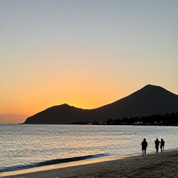 Caribbean Holidays, November Holidays, Peaceful Montserrat beach at sunset with calm Caribbean water, volcanic hills and a small group of visitors