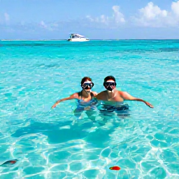 Caribbean Holidays, November Honeymoons, Newlywed couple snorkelling in clear Caribbean water near Saona Island, with tropical fish and a boat in the distance