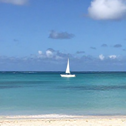 Caribbean Holidays, October Beach Holidays, A small boat sailing past a quiet tropical cay near Providenciales in October, calm turquoise sea and blue sky