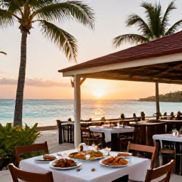 Caribbean Holidays, October Beach Holidays, An open-air beachfront restaurant on Grand Cayman serving fresh seafood at sunset, with palm trees and a calm turquoise sea