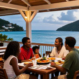 Caribbean Holidays, October Family Holidays, Family enjoying a relaxed Caribbean dinner at an outdoor restaurant in the British Virgin Islands, colourful local food, warm evening light and sea views