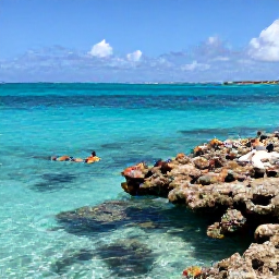 Caribbean Holidays, October Holidays, Visitors snorkelling in clear turquoise water near a coral reef in Turks and Caicos, with bright fish and October sunshine