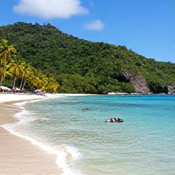 Caribbean Holidays, October Hotspots, Palm-fringed beach at Anse Chastanet in Saint Lucia with clear water, snorkellers and lush green hills