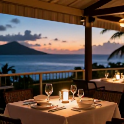 Caribbean Holidays, October Luxury Holidays, Outdoor restaurant serving elegant Caribbean cuisine at sunset in the United States Virgin Islands, softly lit tables and sea view