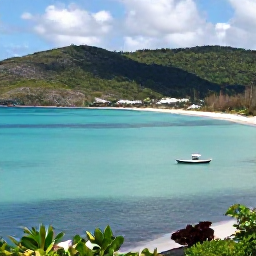 Caribbean Holidays, October Nature Holidays, A peaceful Caribbean bay near Bequia with turquoise water, green hills and a small boat offshore