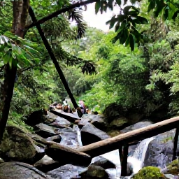 Caribbean Holidays, October Nature Holidays, Caribbean rainforest waterfall surrounded by dense vegetation, wet rocks, a wooden footbridge and visitors walking through the scene