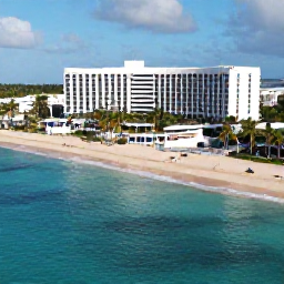 Caribbean Holidays, Puerto Rico All Inclusive, Aerial view of a Puerto Rico beach resort with turquoise sea, palm trees and golden sand