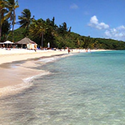 Caribbean Holidays, Puerto Rico Beaches, Flamenco Beach on Culebra, Puerto Rico, with clear shallow water, white sand, green hills and visitors relaxing in the sunshine