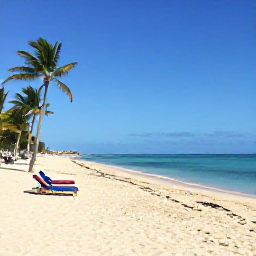 Caribbean Holidays, Puerto Rico Beaches, Relaxed beach scene at Isla Verde near San Juan, Puerto Rico, with white sand, clear blue water, sun loungers and palm trees