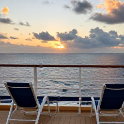 Caribbean Holidays, Puerto Rico Cruises, A relaxed cruise deck overlooking the Caribbean Sea at sunset, with deck chairs, gentle waves and warm evening light