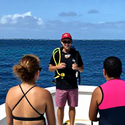 Caribbean Holidays, Puerto Rico Diving, Friendly scuba diving instructor briefing holidaymakers beside a boat in Puerto Rico