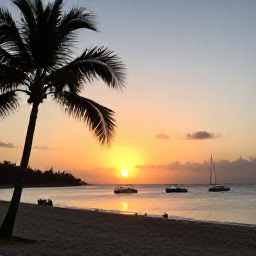 Caribbean Holidays, Puerto Rico Diving, Sunset over a Puerto Rico beach with dive boats, palm trees and warm evening light
