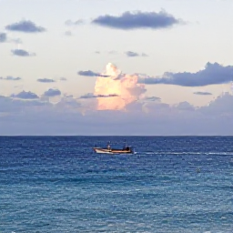 Caribbean Holidays, Puerto Rico Fishing, A calm Puerto Rico coastline at sunrise in September, with a small fishing boat heading towards deep blue Caribbean waters