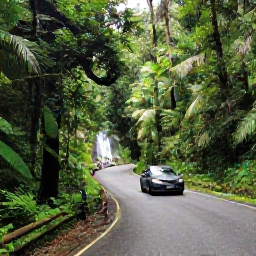 Caribbean Holidays, Puerto Rico Fly Drive, A hire car on a winding rainforest road in El Yunque National Forest, with lush green vegetation, a waterfall and visitors walking on a trail