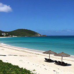 Caribbean Holidays, Saint Barth Beach Holidays, A panoramic view of a quiet white-sand beach on Saint Barth&eacute;lemy, with turquoise Caribbean water, green hills and a few elegant beach umbrellas