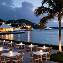 Caribbean Holidays, Saint Barth Beach Holidays, A stylish but relaxed evening scene in Gustavia, Saint Barth&eacute;lemy, with harbour lights, outdoor dining and boats in the bay