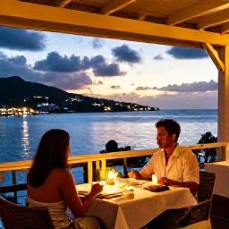Caribbean Holidays, Saint Barth Couples, Couple dining at an elegant open-air restaurant in Gustavia, Saint Barth&eacute;lemy, with harbour lights and a sunset sky