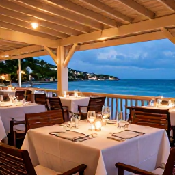 Caribbean Holidays, Saint Barth May, Elegant open-air restaurant in Gustavia, Saint Barth&eacute;lemy, serving a relaxed dinner beneath soft evening lights