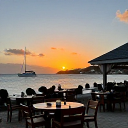 Caribbean Holidays, Saint Barthelemy Beaches, A relaxed waterfront restaurant in Gustavia, Saint Barth&eacute;lemy, at sunset, with outdoor tables, sailing boats and warm island light