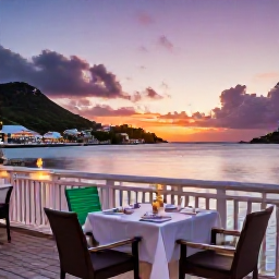 Caribbean Holidays, Saint Barthelemy Honeymoons, Elegant waterfront restaurant in Gustavia, Saint Barth&eacute;lemy, with tables for two and a colourful Caribbean sunset