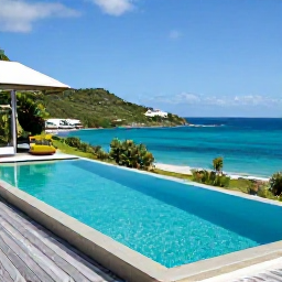 Caribbean Holidays, Saint Barthelemy Luxury, Luxury private villa with infinity pool overlooking the Caribbean Sea on a green hillside in Saint Barthelemy