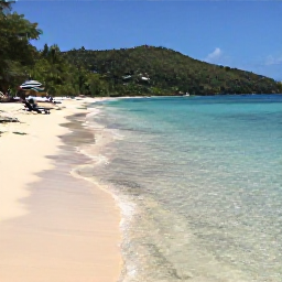 Caribbean Holidays, Saint Lucia Beaches, Reduit Beach in Saint Lucia on a sunny May day, with clear shallow water, soft sand, loungers and lush hills in the distance