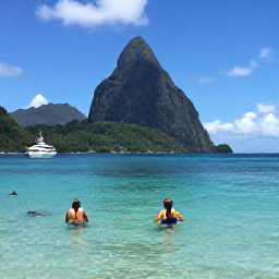 Caribbean Holidays, Saint Lucia Hopping, Boat sailing past the Pitons in Saint Lucia, with snorkellers in clear water and a sunny Caribbean coastline