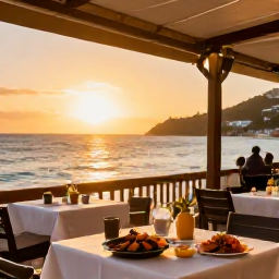 Caribbean Holidays, Saint Martin Beaches, A relaxed beachfront restaurant in Saint Martin at sunset, with tables overlooking the sea, local seafood and warm golden light