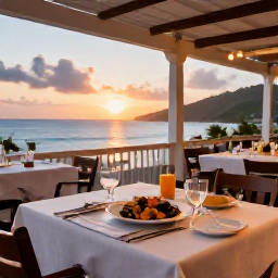 Caribbean Holidays, Saint Vincent April, Elegant seaside restaurant in Saint Vincent and the Grenadines serving fresh local seafood at sunset