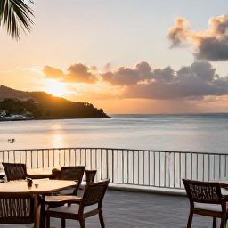 Caribbean Holidays, Saint Vincent April, Luxury Caribbean hotel terrace overlooking a calm bay at sunset on Saint Vincent and the Grenadines