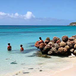 Caribbean Holidays, Saint Vincent Beaches, Snorkellers exploring a colourful coral reef in clear Caribbean water near the Grenadines, with tropical fish and a bright sandy seabed