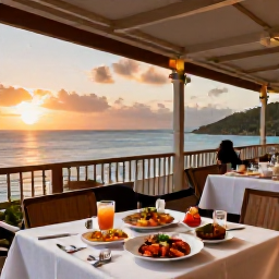 Caribbean Holidays, Saint Vincent Business Class, Elegant Caribbean restaurant terrace at sunset with fresh seafood and views across the sea