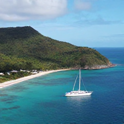 Caribbean Holidays, Saint Vincent Luxury, Aerial view of Saint Vincent and the Grenadines, with lush green hills, turquoise sea and a luxury sailing yacht