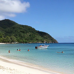 Caribbean Holidays, September Beaches, Small boat approaching Rendezvous Bay on Montserrat, snorkellers in clear blue water, quiet tropical coastline and green hills