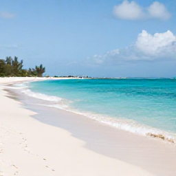 Caribbean Holidays, September Beaches, Wide white-sand beach and turquoise sea in Turks and Caicos under soft September sunshine