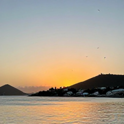 Caribbean Holidays, September Birdwatching, A calm September sunset over the harbour and hills of Saint Barth&eacute;lemy, with tropical birds in the evening sky