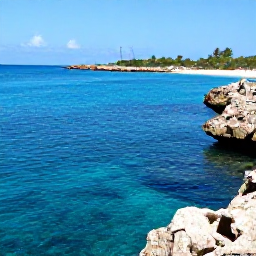 Caribbean Holidays, September Cura&ccedil;ao, Cura&ccedil;ao snorkelling scene with clear blue water, colourful reef fish, rocky coastline and a small beach under a sunny sky