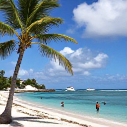 Caribbean Holidays, September Diving, Relaxed Caribbean beach on Saint Martin with palm trees, calm sea, snorkellers and a small dive boat in the distance