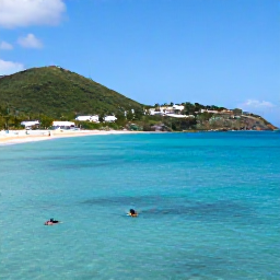 Caribbean Holidays, September Escapes, Clear Caribbean water and a couple snorkelling near a sandy cove in Saint Barth&eacute;lemy, with green hills and bright September skies