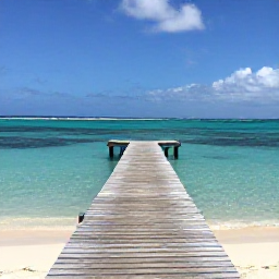Caribbean Holidays, September Instagram Spots, A small wooden jetty leading into bright turquoise water at Leeward Beach, Turks and Caicos, with a clear September sky