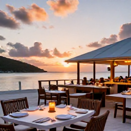 Caribbean Holidays, September Luxury, A relaxed waterfront restaurant serving fresh seafood at sunset on a British Virgin Islands beach