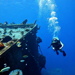 Caribbean Holidays, September Scuba Diving, Divers descending beside a dramatic shipwreck on the seabed near Aruba, with tropical fish and clear visibility