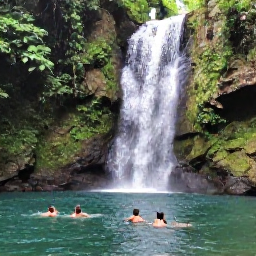 Caribbean Holidays, September Tours, Waterfall and lush tropical forest near Jarabacoa in the Dominican Republic, travellers swimming in a natural pool during a September tour