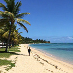 Caribbean Holidays, September Walking, A quiet sandy beach and coastal path on Antigua in September, with palm trees, calm blue water and walkers in the distance