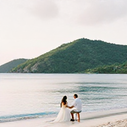 Caribbean Holidays, September Weddings, Couple enjoying a quiet September morning on a Caribbean beach in St John, United States Virgin Islands, with calm sea and lush hills